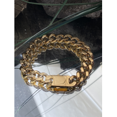 Stalen goudkleurige armband met grove schakels. L 24 cm